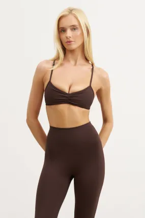 product sporty style statement product shiny accents appeal Base Sculpting Skinny Ruched Bra - Carob